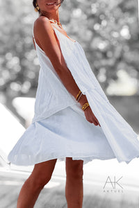 Robe blanche fluide à volants