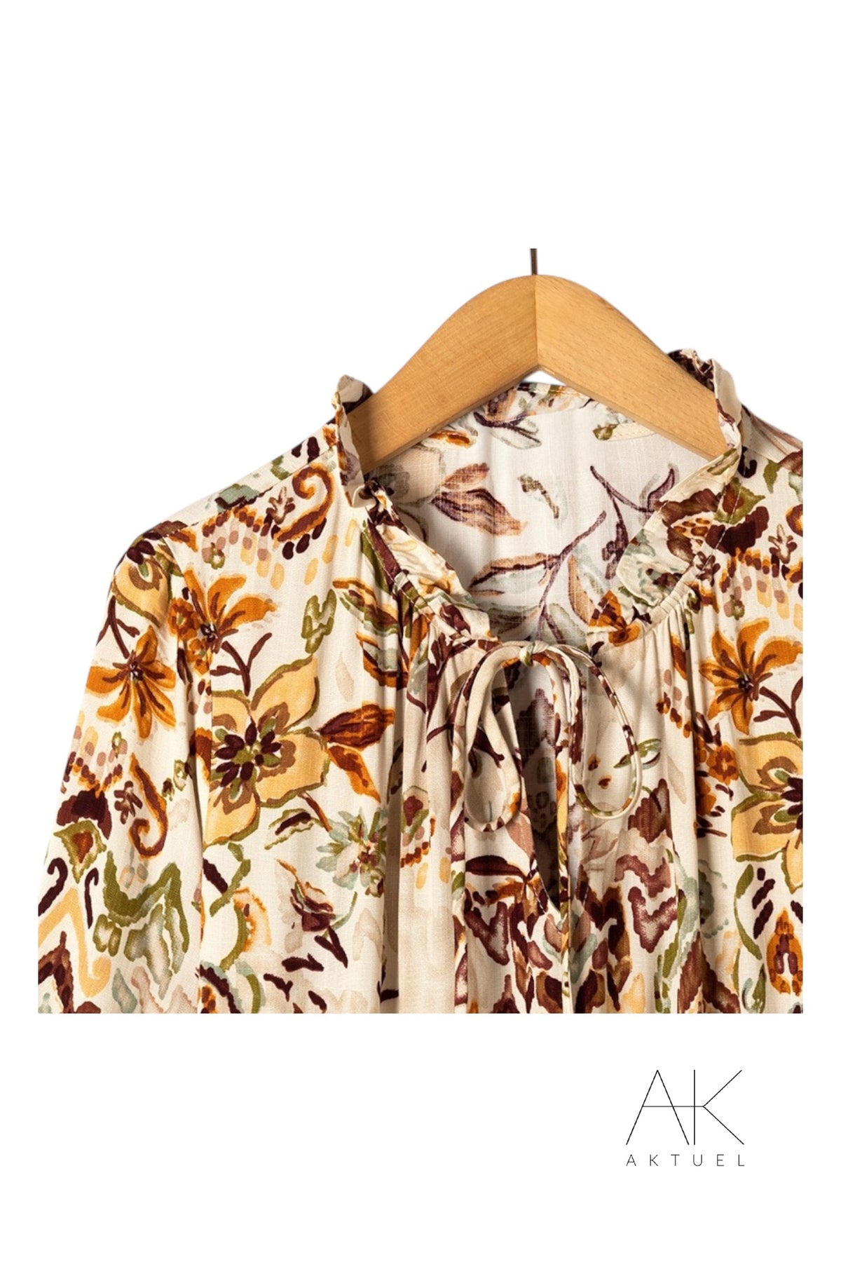 Robe imprimée rouille ceinturée à manches longues