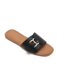Mules noires plates à boucle dorée