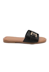 Mules noires plates à boucle dorée
