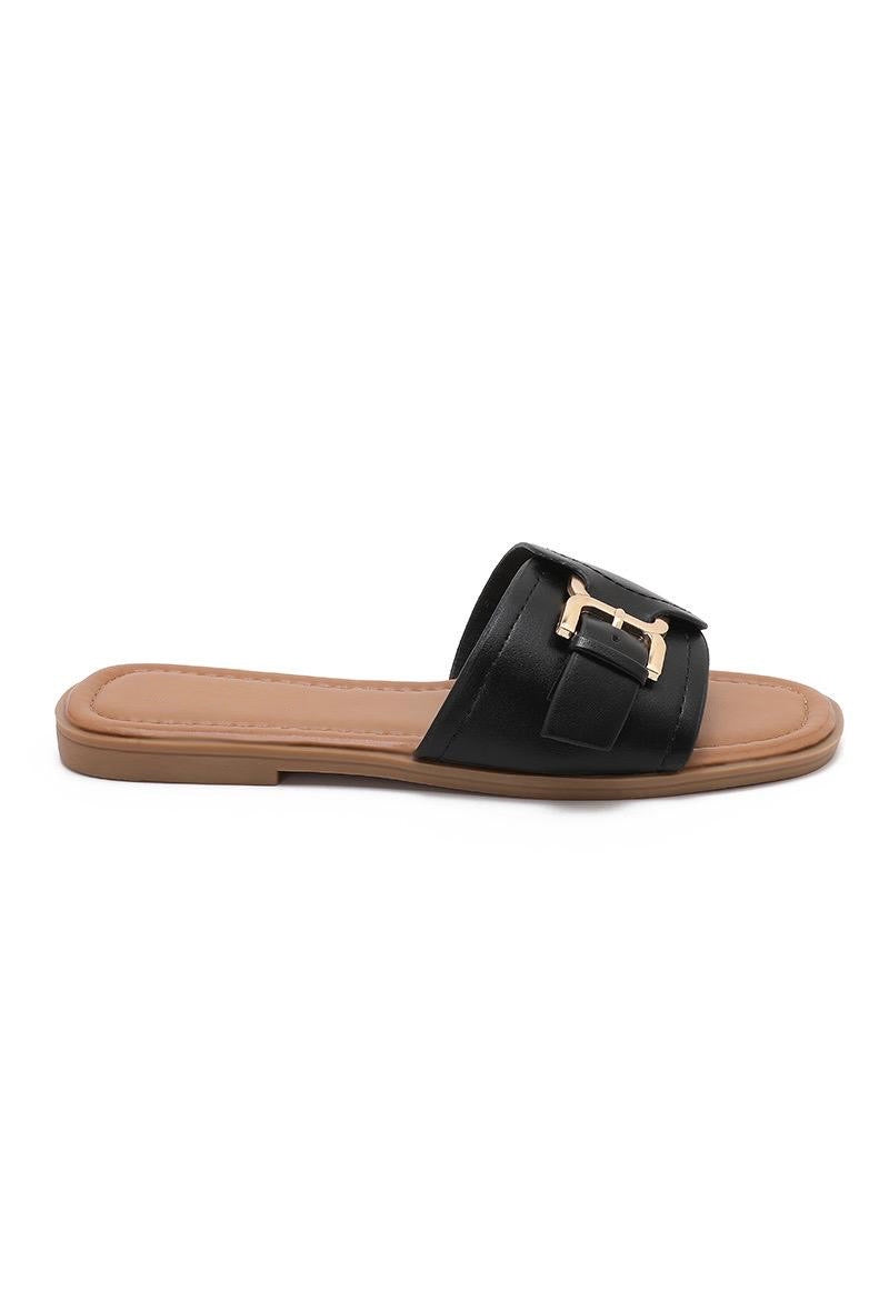 Mules noires plates à boucle dorée