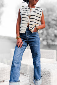 Top en maille rayée noir avec des boutons broches soleil