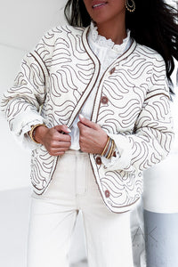 Veste matelassée crème à motifs ondulés