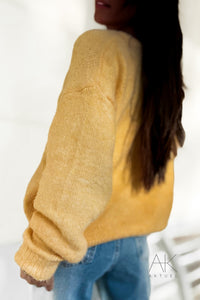 Cardigan en maille jaune pastel