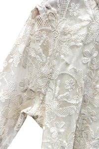 Top en dentelle brodée blanche
