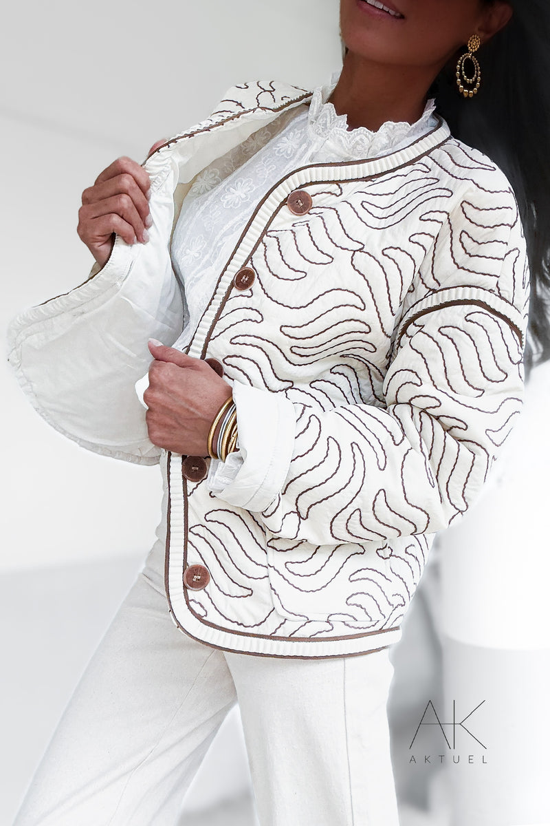 Veste matelassée crème à motifs ondulés