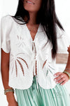 Top blanc à broderies palmier