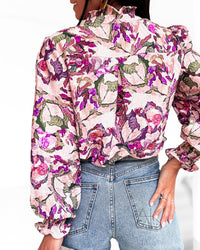 Blouse fleurie rose et violet – Col volanté et manches bouffantes