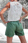 Top sans manches blanc en broderie anglaise