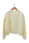Cardigan en maille jaune pastel