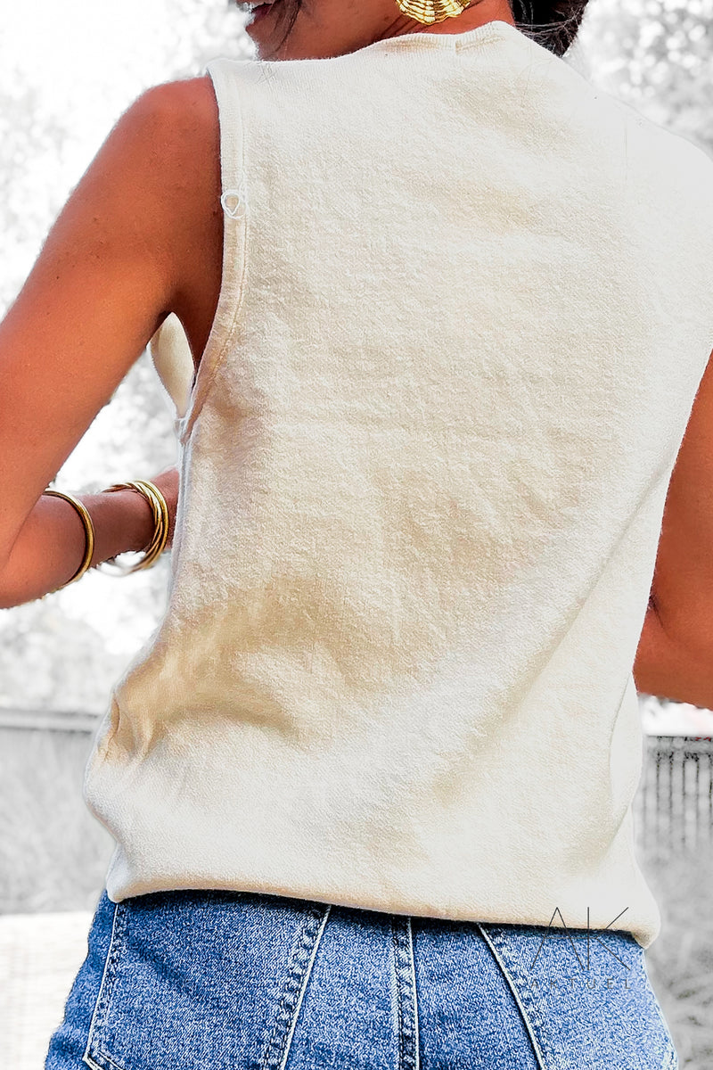 Top en maille col V avec broche étoile