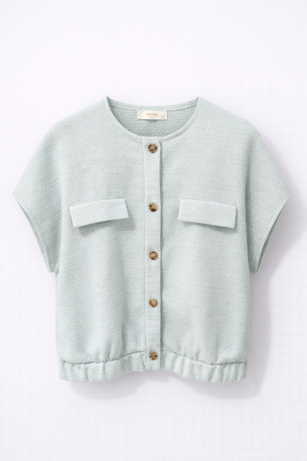 Veste courte en tweed vert d’eau