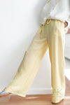 Pantalon large jaune pastel à rayures